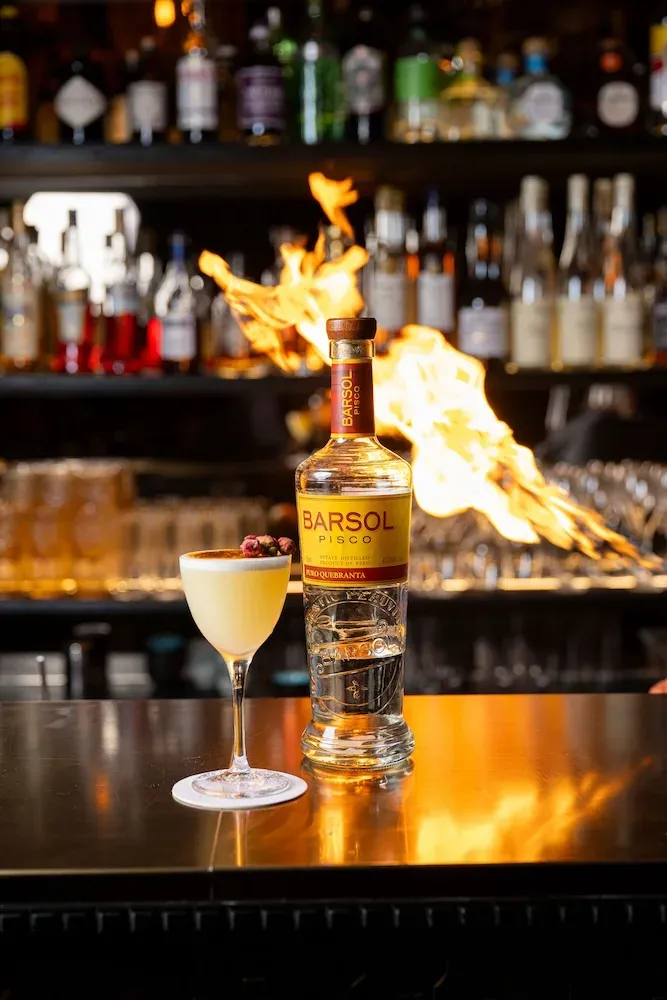 A flaming cocktail at Madame Claude